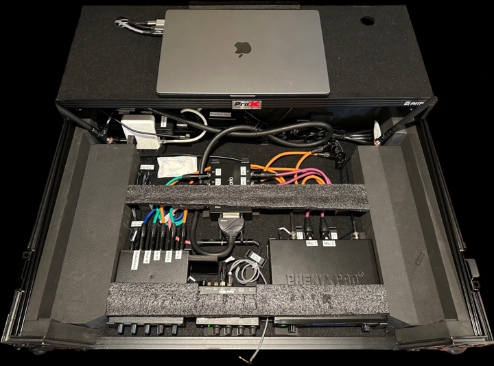 DJ Controller case with lower level equipment, patch cables installed and foam cushioning above lower level equipment